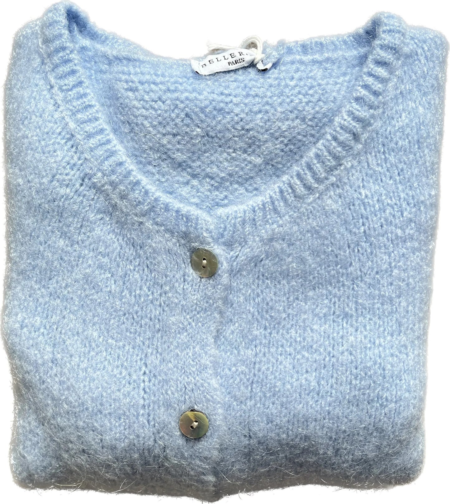 Folded light blue sweater with buttons on a white background