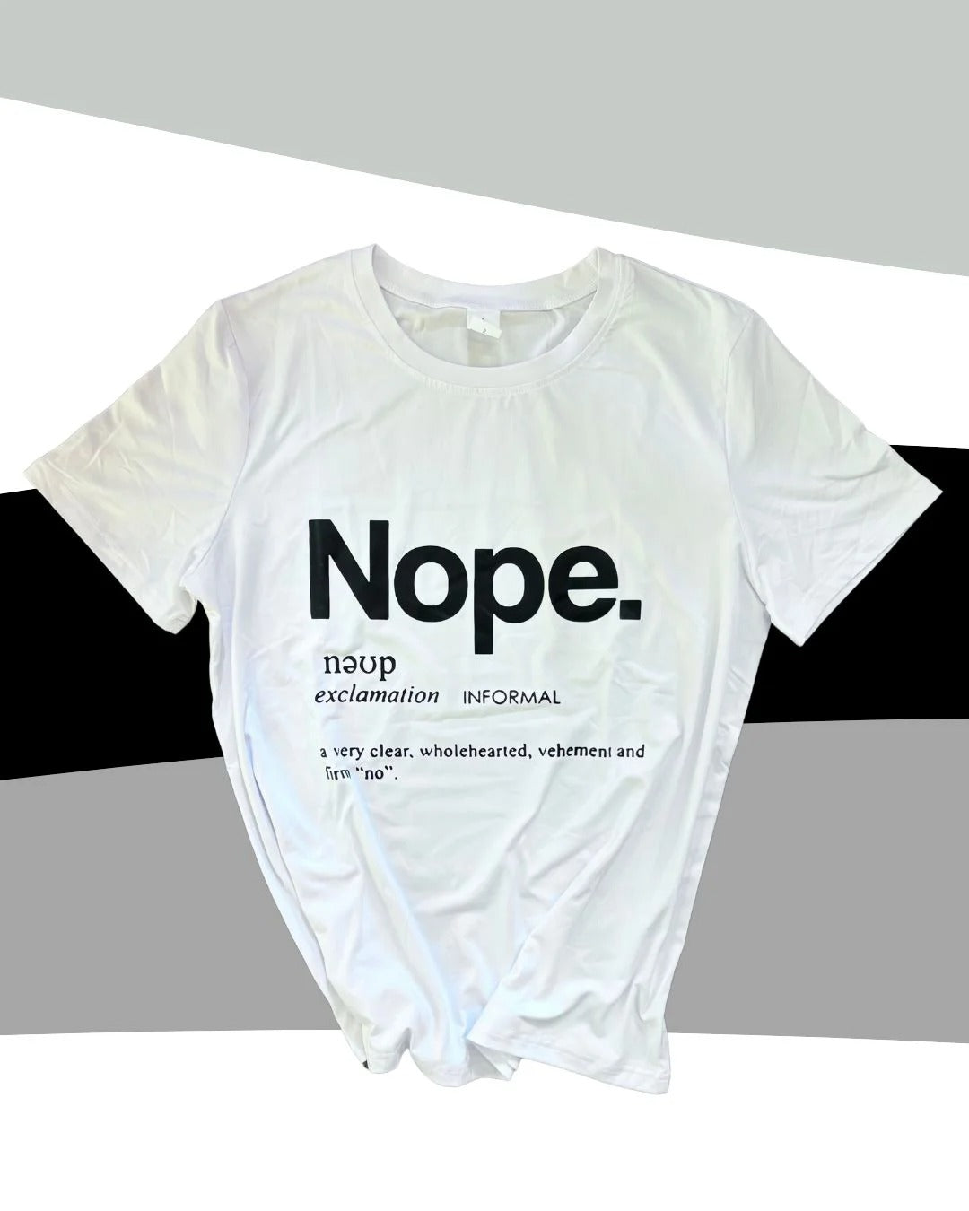 White t-shirt with 'Nope.' text on a gray background