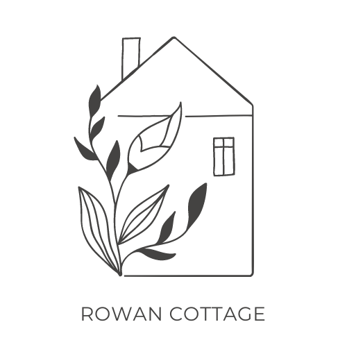Logo of Rowan Cottage with a house and leaves design on a white background