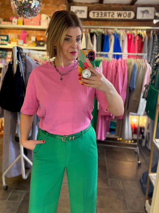 classic plain pink t-shirt with bright green trousers