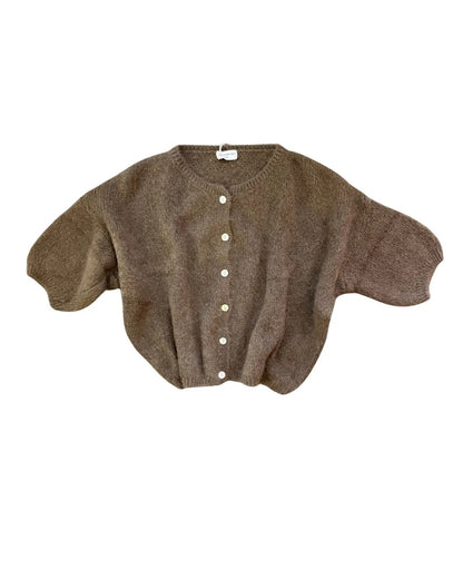 Brown cardigan with button details on a white background