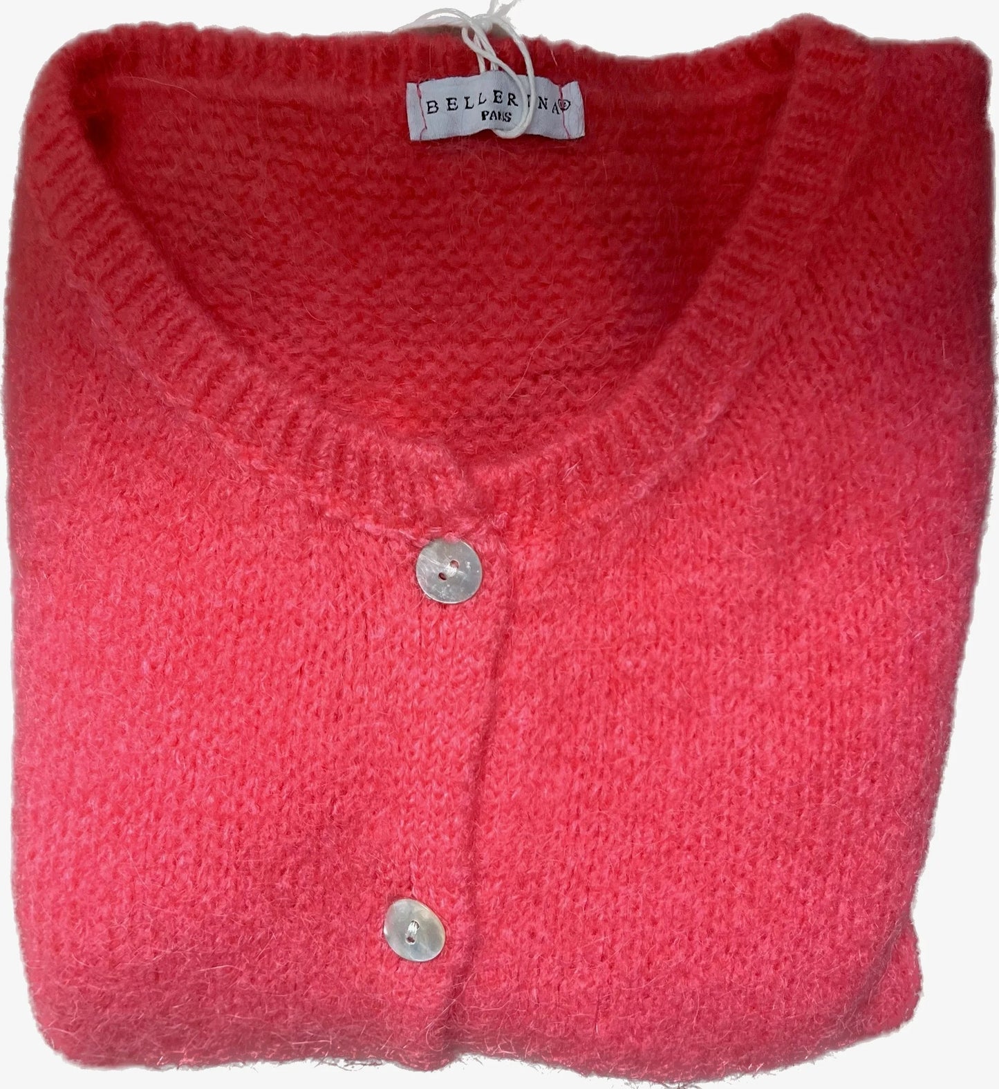 Folded pink cardigan with button details on a white background