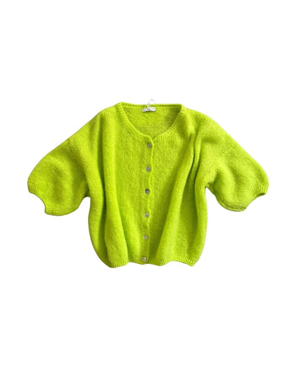 Bright green cardigan on a white background