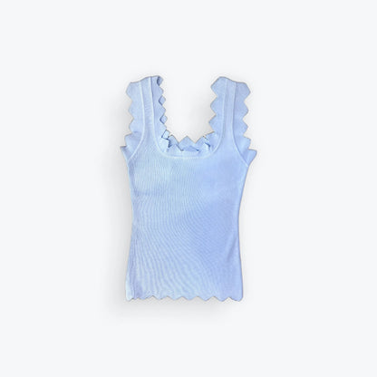 Light blue tank top with ruffled straps on a white background