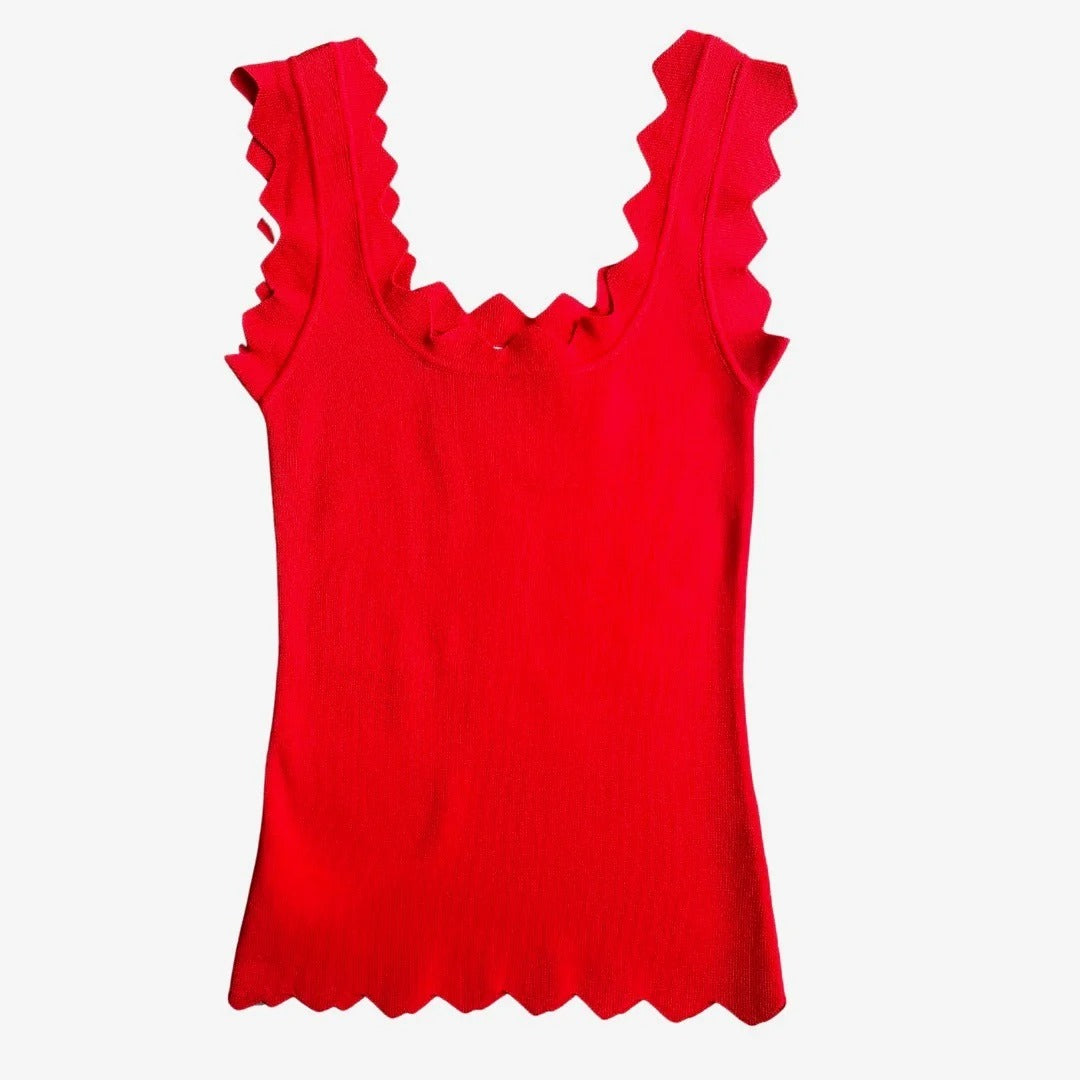 Red tank top with ruffled details on a white background