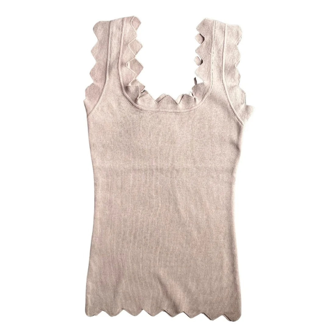 Beige tank top with scalloped trim on a white background