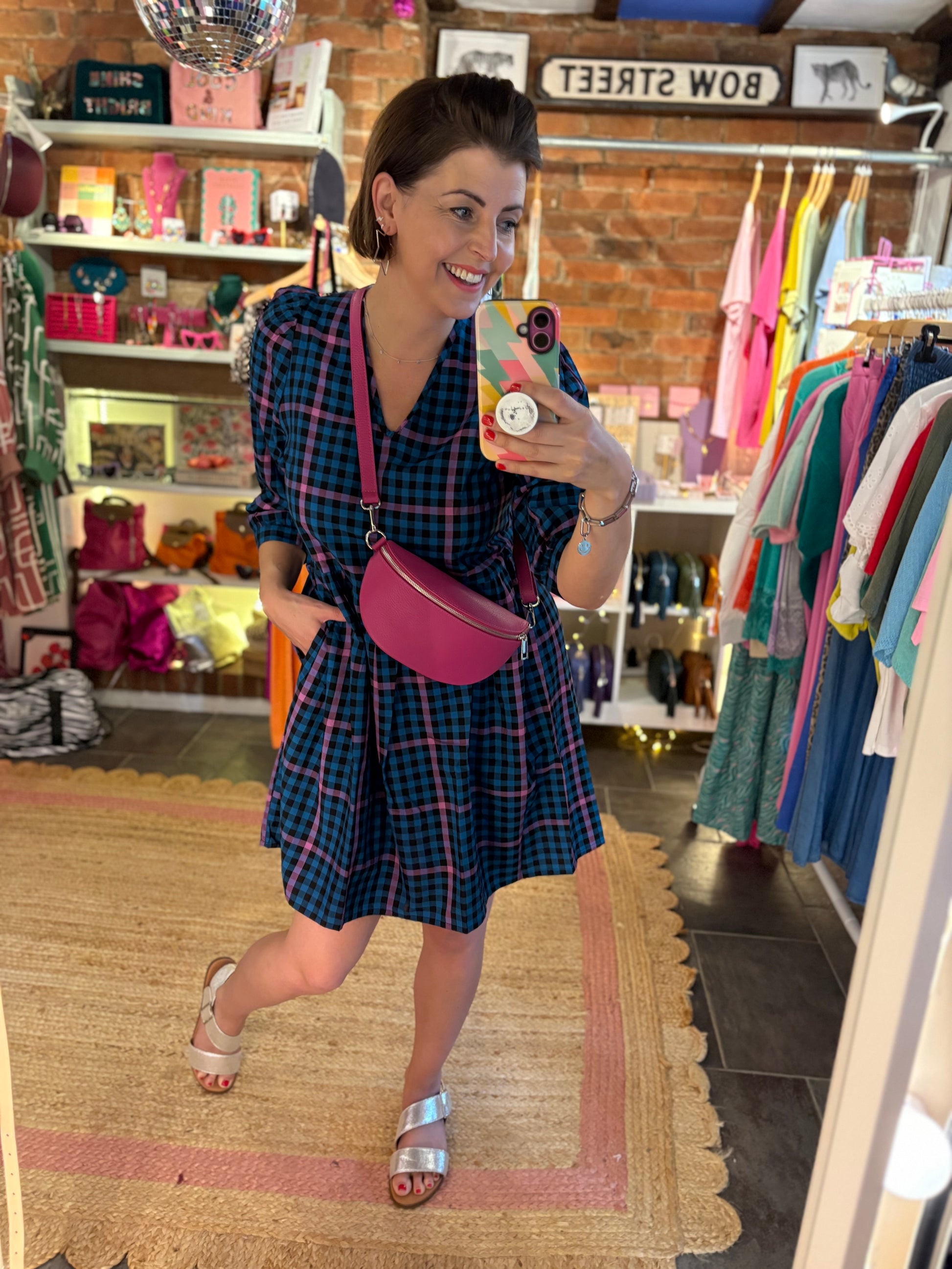 blue and dusky pink check print dress with pink crossbody sling bag