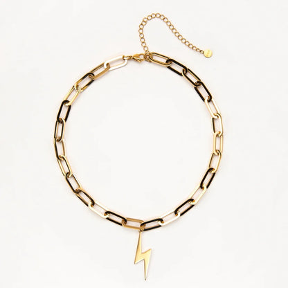 Gold chain bracelet with a lightning bolt charm on a white background