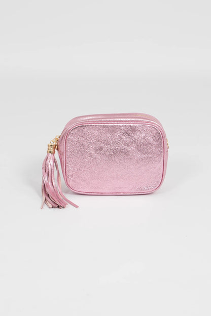 Pink glittery pouch with a tassel on a light gray background