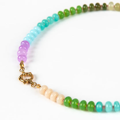 Multicolored beaded necklace with a gold clasp on a white background