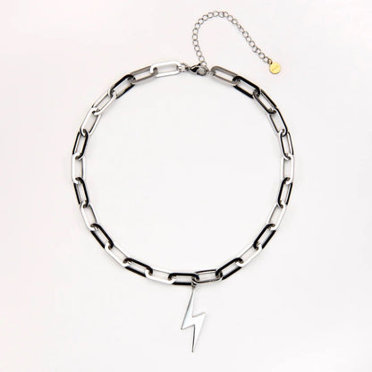 Silver chain necklace with a lightning bolt pendant on a white background